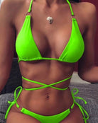 Daniela Triangle Bikini Neon Green Introducing the must-have Daniela Neon Green Triangle Bikini! This stunning set features an adjustable top with a stylish ring embellishment and versatile multiway design. The bottom also boasts a ring embellishment and adjustable side ties for the perfect fit. Dive into summer with style and confidence in this eye-catching bikini!  Neon green adjustable bikini set Triangle ring-embellished multiway top Ring-embellished side tie bottoms 